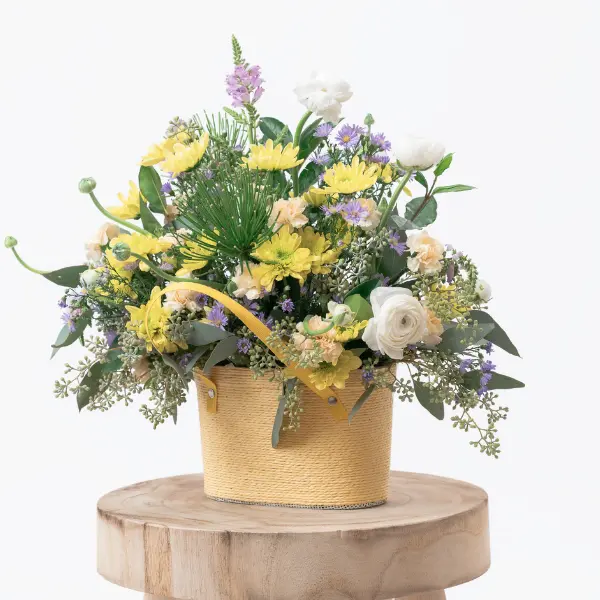 Easter Flower Arrangement in Basket with Seasonal Blooms