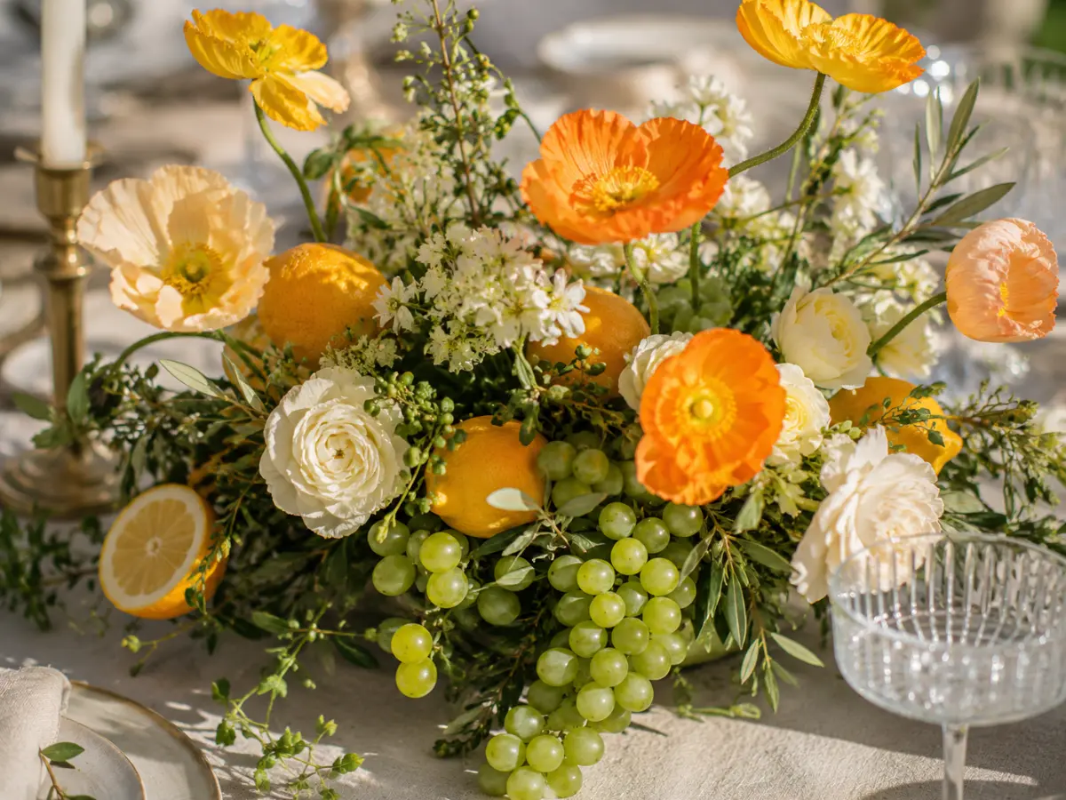 Garden-inspired wedding flowers styled with lemons, grapes and seasonal blooms